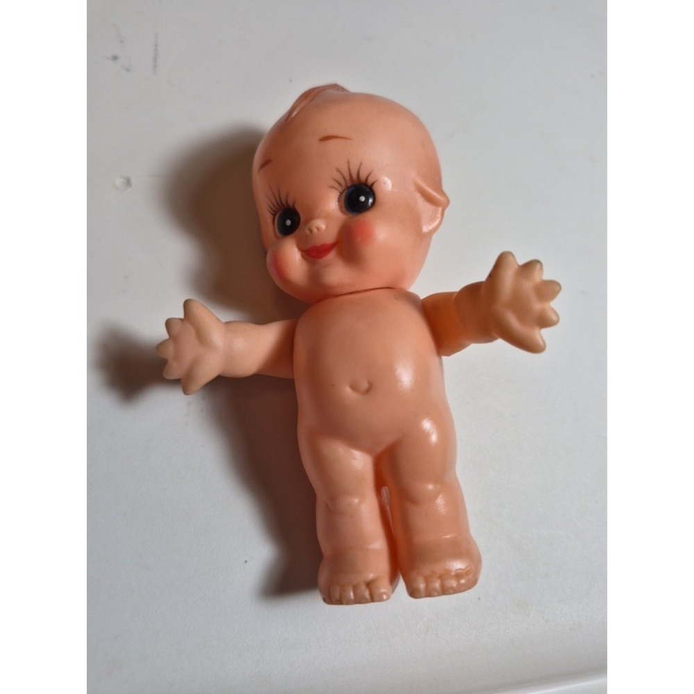 Kewpie doll 4 1/2 inches tall with movable arms stationary legs